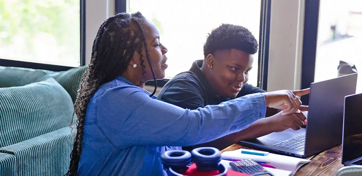 mom and son using the computer