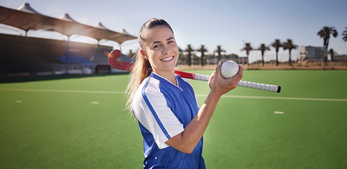 Student with a hockey stick